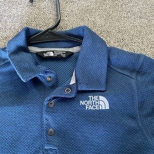2 Boys shirts- periwinkle blue NorthFace and black/grey Under Armour
